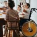 family having breakfast, one of the children is in a wheelchair