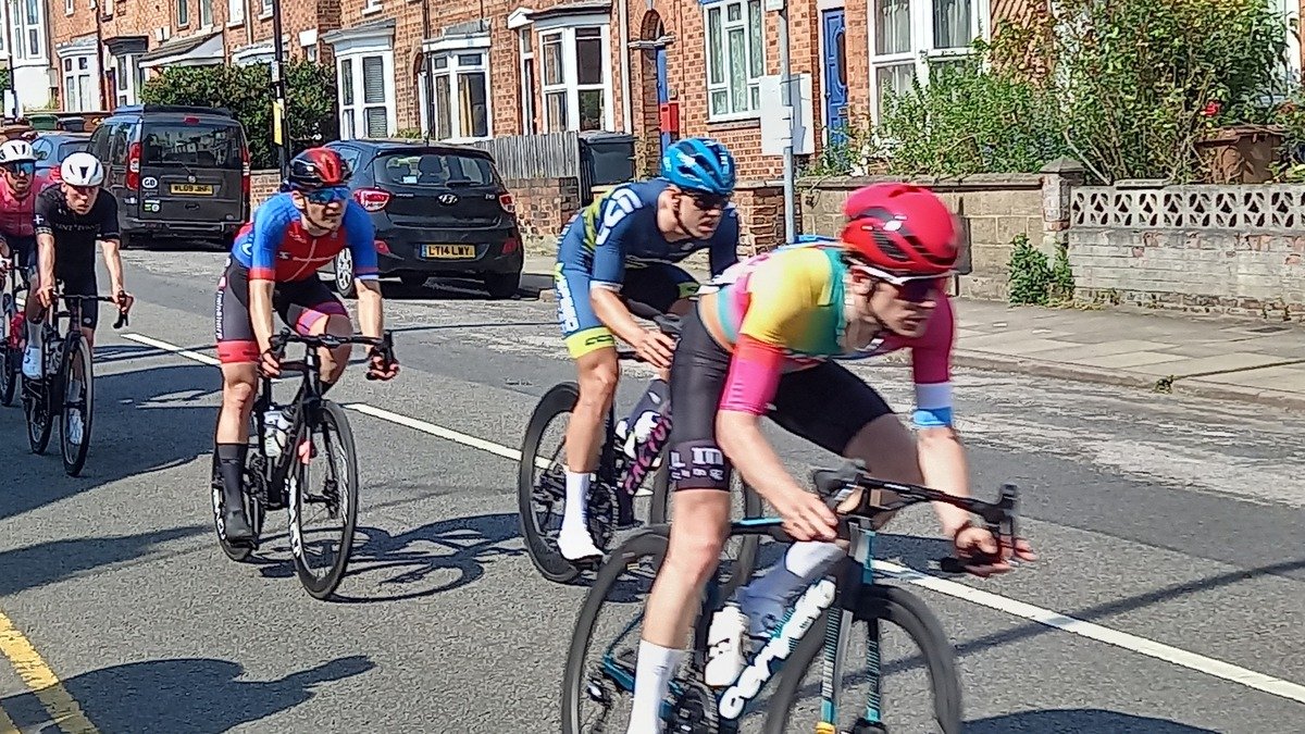 people riding bikes, the one in front goes so fast the image is lightly blurred