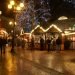 Evening scene of an outdoor market with Christmas lights