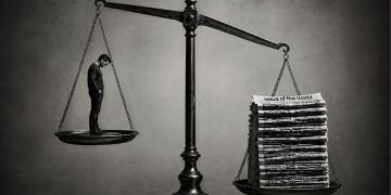 Weighing scales with a man with his head bowed on the left scale and a stack of heavy newspapers on the right hand scale the scale is unbalanced