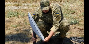 Support Forces of Ukraine soldier installing a Starlink terminal
